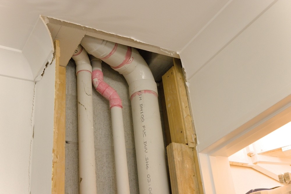 exposed residential drain pipes