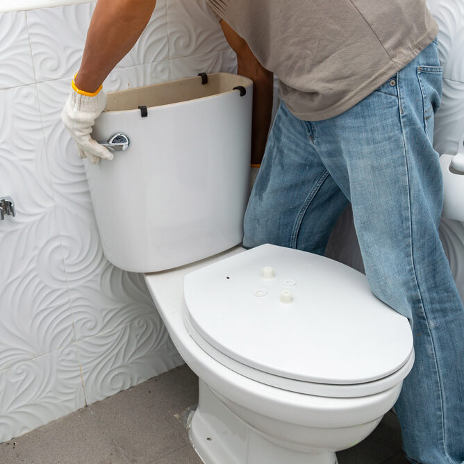 Workerman,Performs,Repair,Of,Toilet,Bowl,,To,Repair,The,Pipe